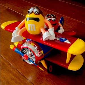 M & M Barnstorming rides candy dispenser.